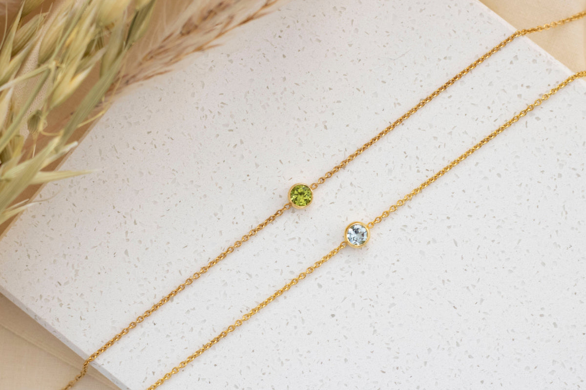 Filigranes Goldarmband in 585 Gelbgold mit einem runden Peridot oder Blau Topas Edelstein