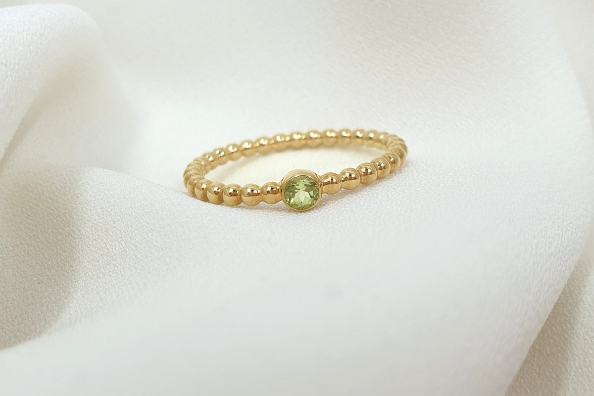 Kugelring 2 mm aus 585 Gelbgold mit Peridot
