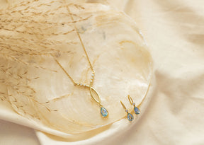 Zarte Goldohrringe aus 585 Gelbgold mit Brillanten und Blau Topas